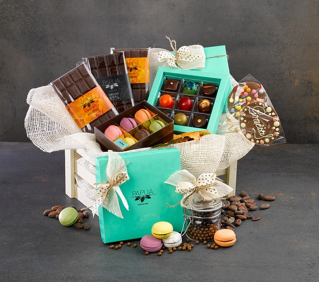 Gift box with sweets, macaroni and chocolate