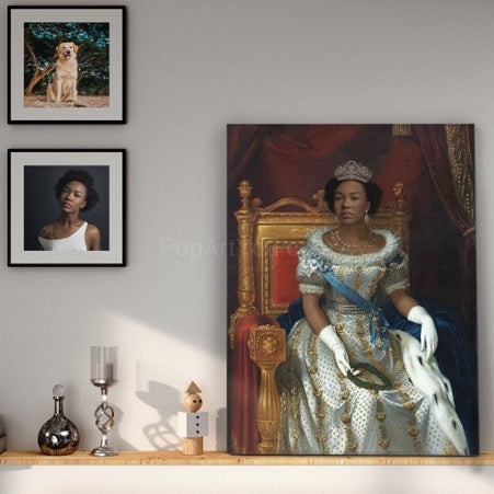 There is a portrait of a woman in a royal costume on a wooden shelf, while a portrait of a dog and a portrait of a woman hang on a white wall