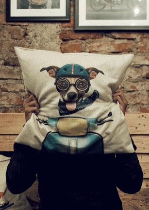 Pillow with print of a dog in a motorcycle helmet and goggles driving a motorcycle