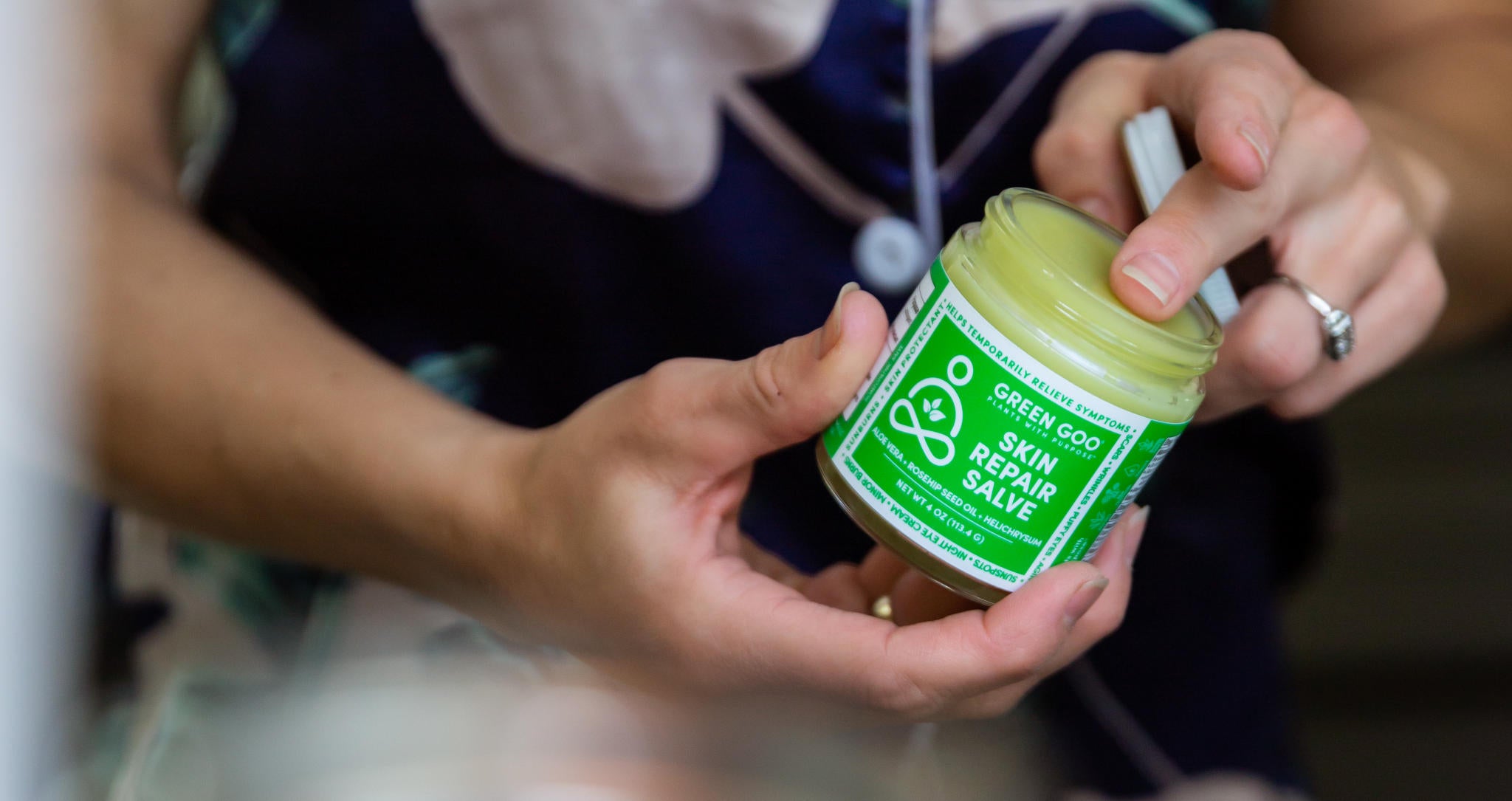 Green Goo's Skin Repair salve in a jar