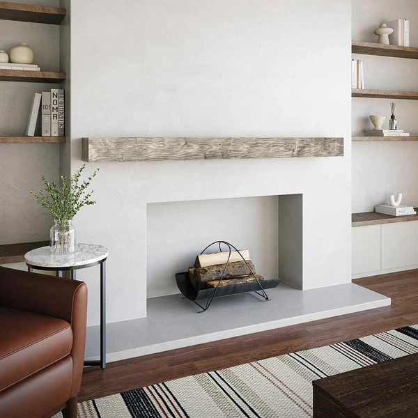 Ashcroft mantel with clean fireplace filled with decor.