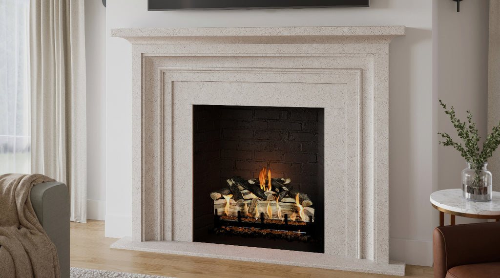 Gas log set in a white surround and mantel with hearth.