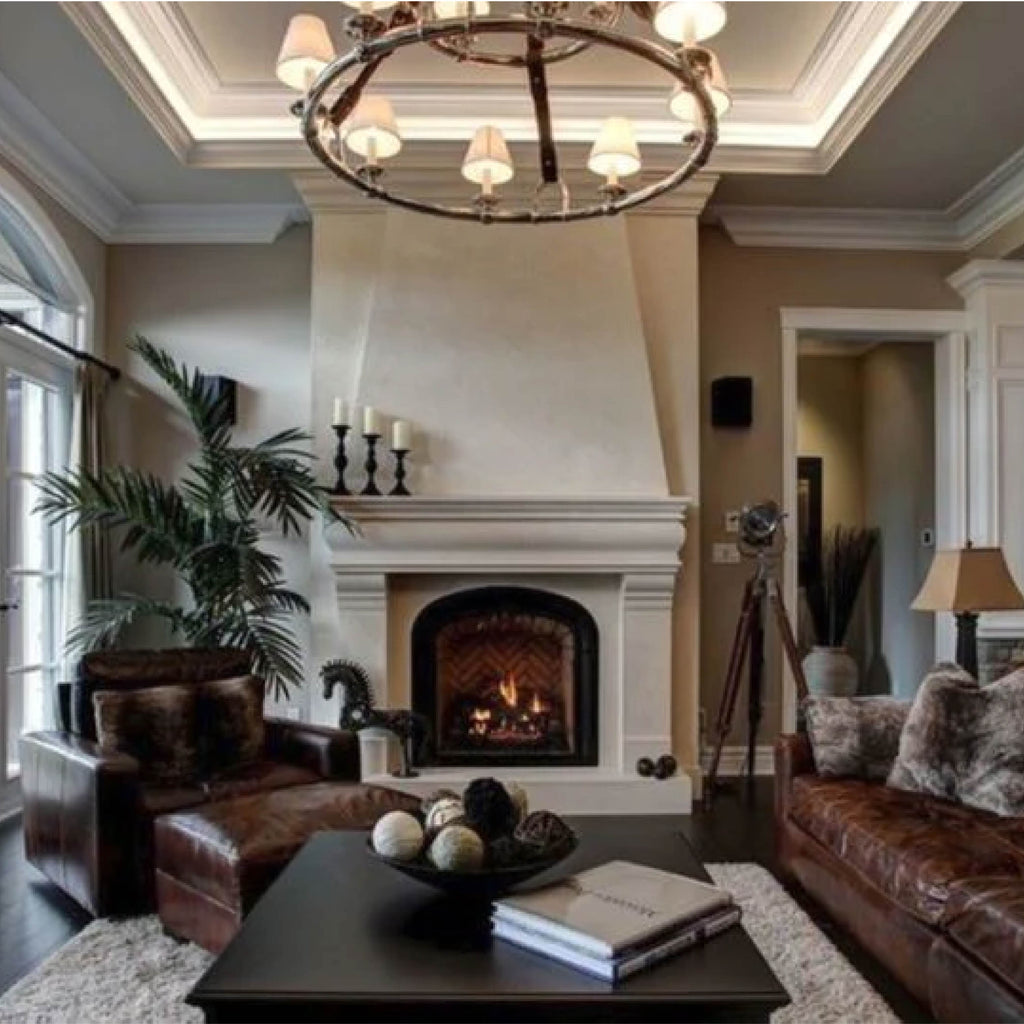 Colonial style cast stone fireplace in a swanky, rustic living room.