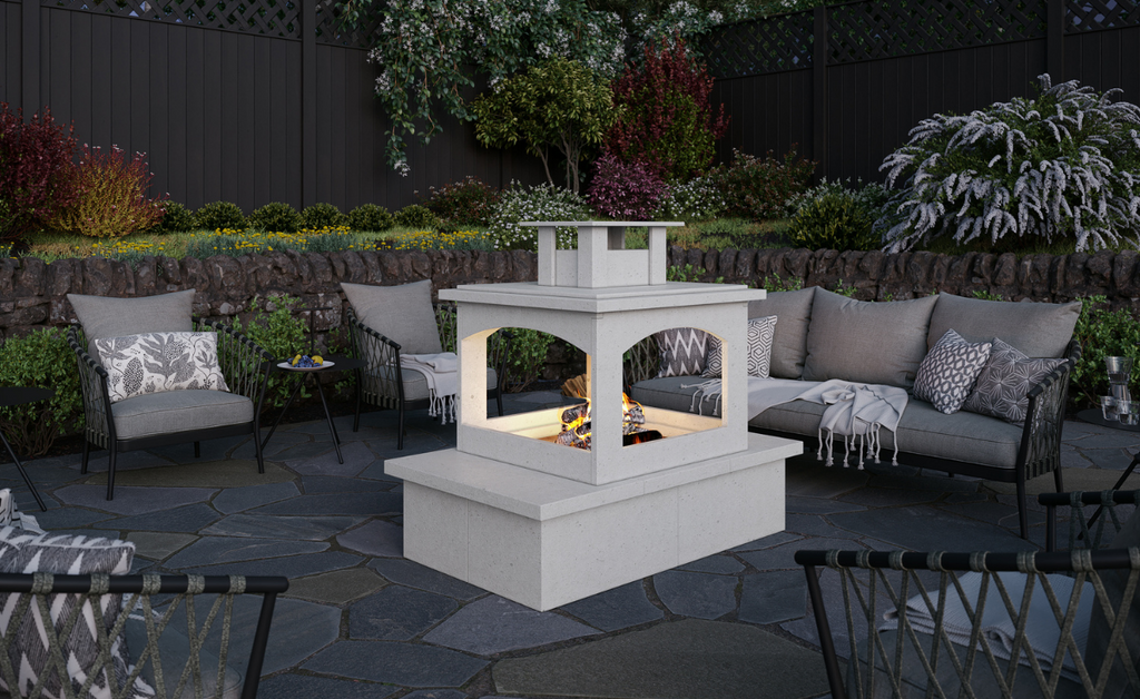 The perfect fireplace on an outdoor patio surrounded by furniture.
