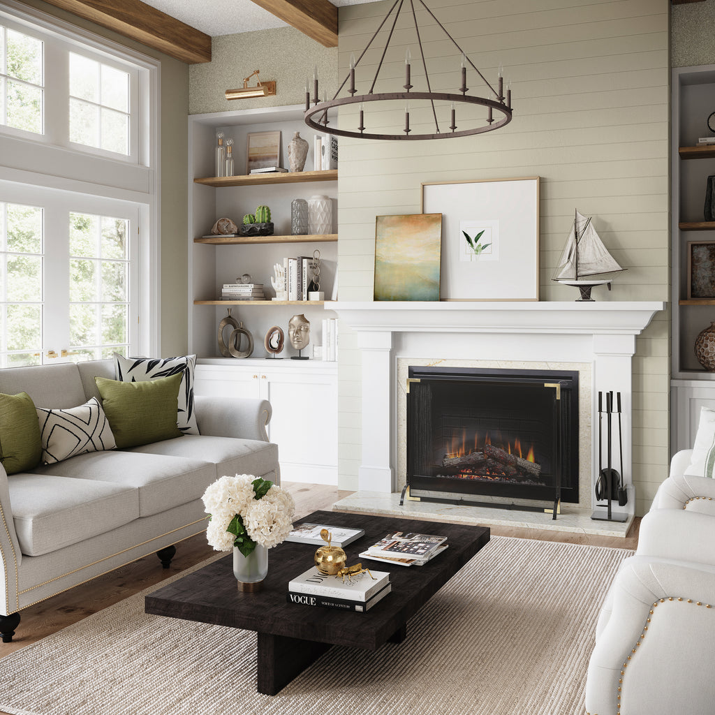 Large living room with fireplace and white mantel with fireplace tools on the side.