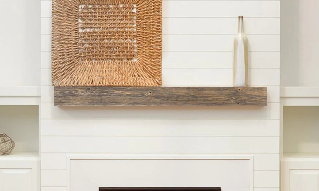 The Vail mantel installed on a white wall with fireplace and simple decor.