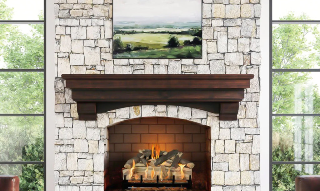 Traditional wood mantel with high detail in a white stone surround with art above the mantel.