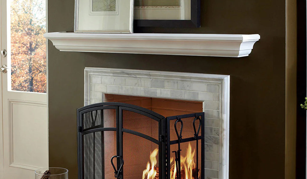 White wood mantel over a fireplace.