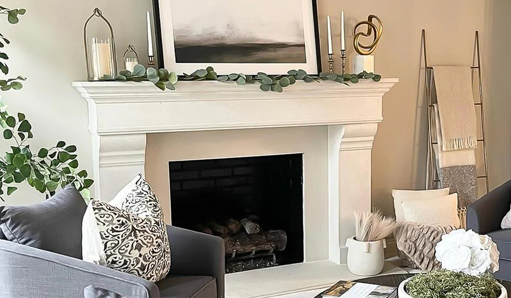 Living room with stone fireplace surround and mantel in light beige.