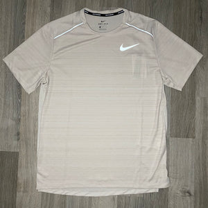 beige nike miler