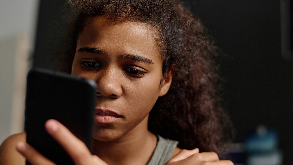 woman looking at her cellphone