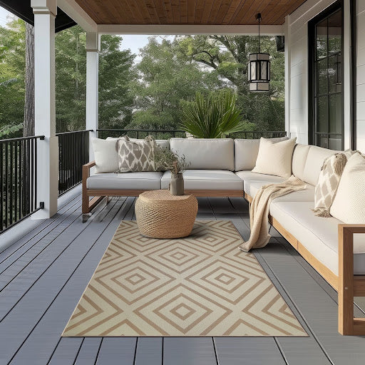 Jute Aria Double-Diamond Natural Washable Rug 5'x7' on a patio with a sectional.