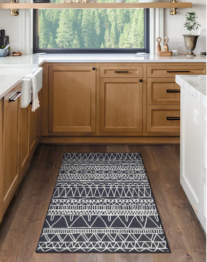 My Magic Carpet's Chelsea Tribal Aztec grey washable rug in a kitchen.
