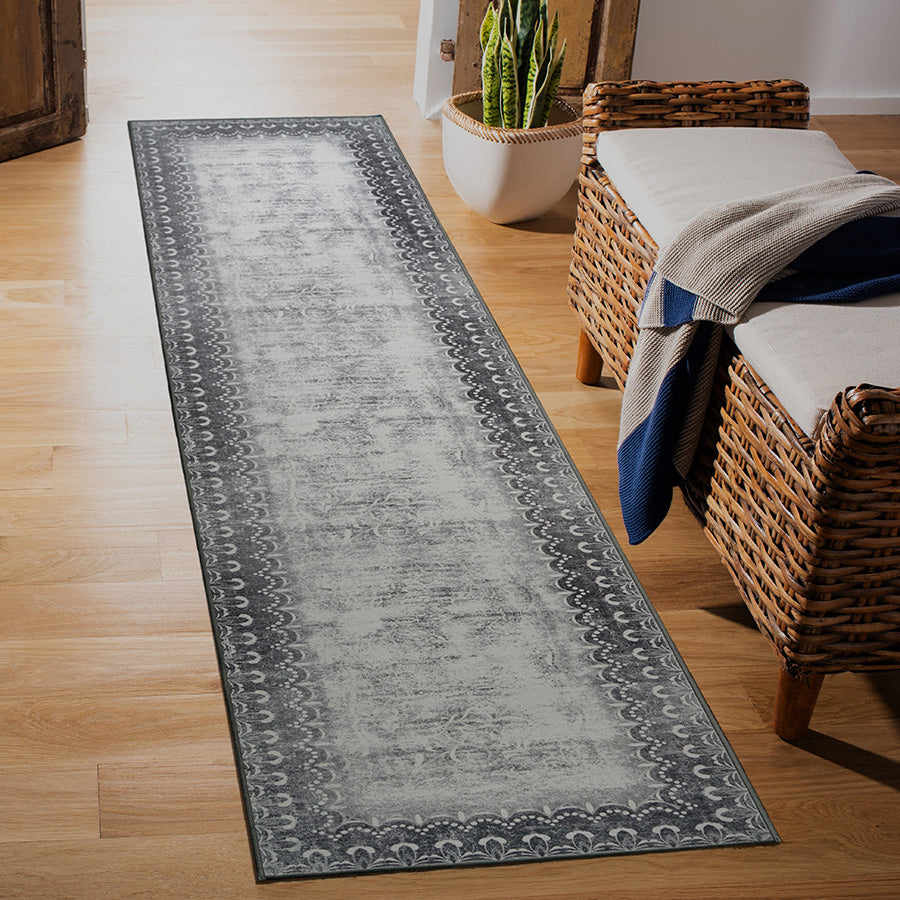 Washable vintage style washable runner rug in entryway.