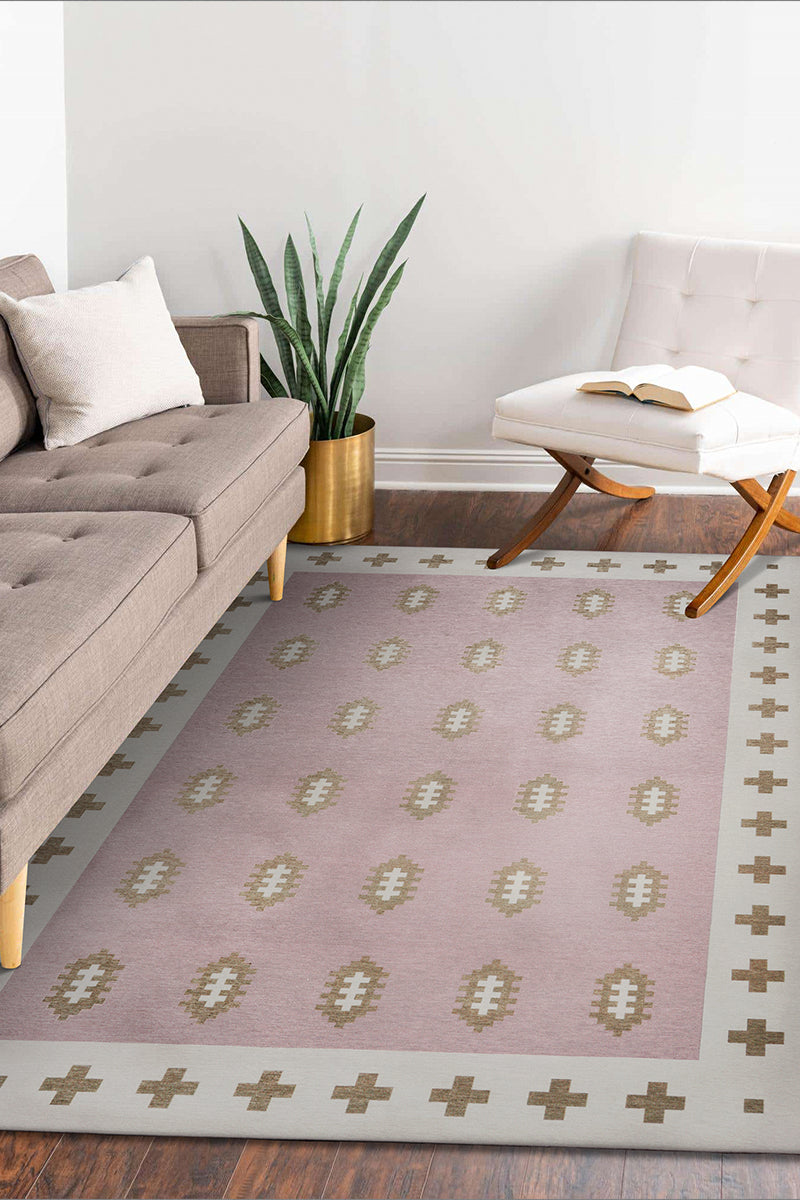 Genevieve Gorder x My Magic Carpet nordic weave petal pink washable rug in a living room.