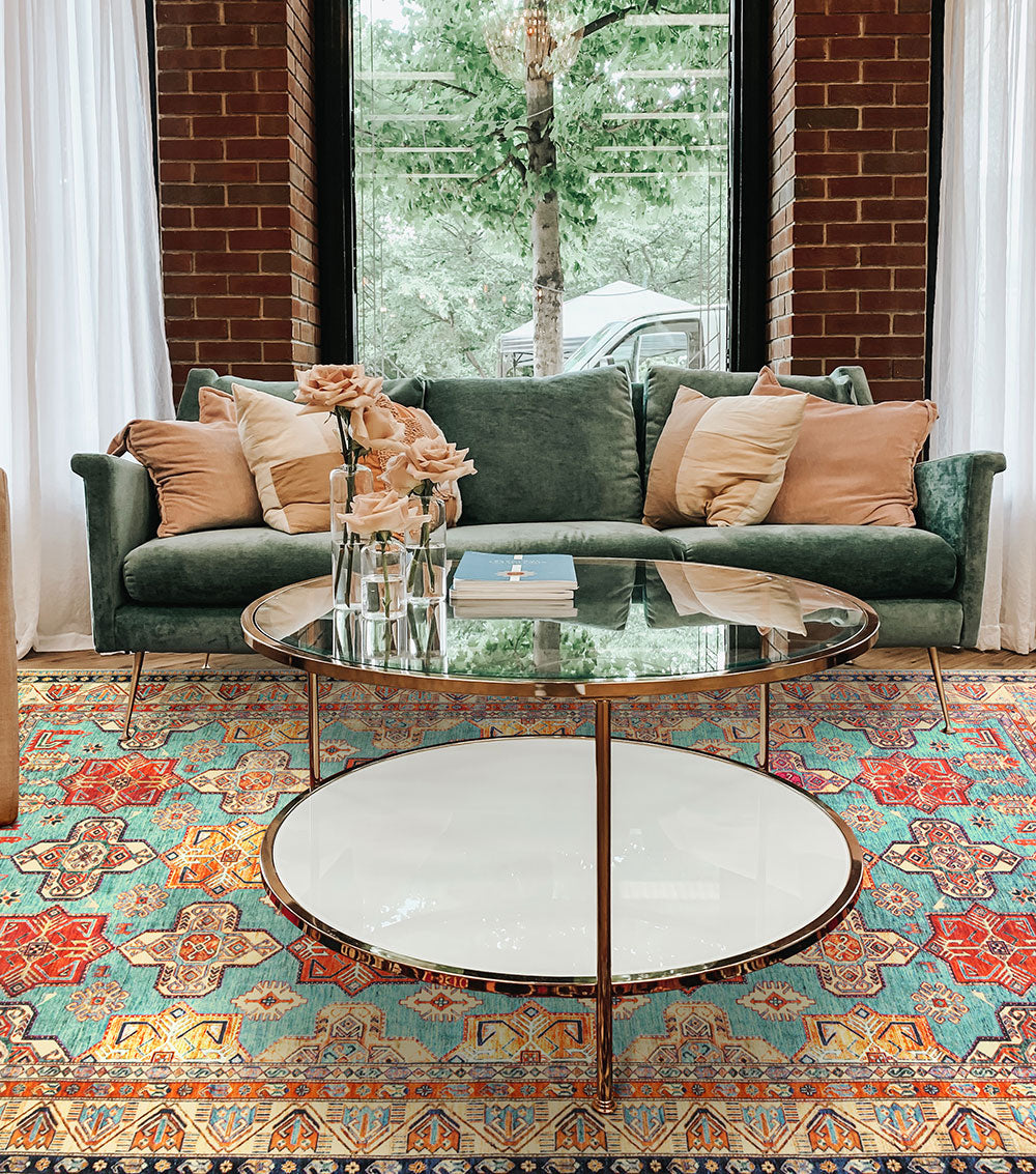 A luxury living room with My Magic Carpet's 6'x9' Ottoman Turquoise washable rug.