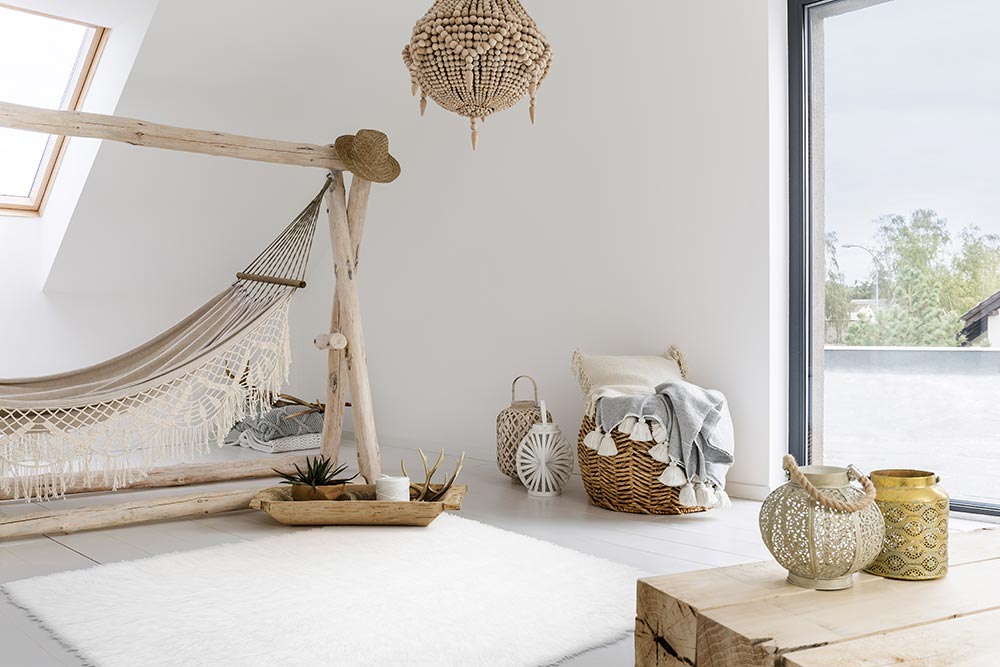 A boho bedroom with a hammock and the My Magic Carpet white shag washable rug.