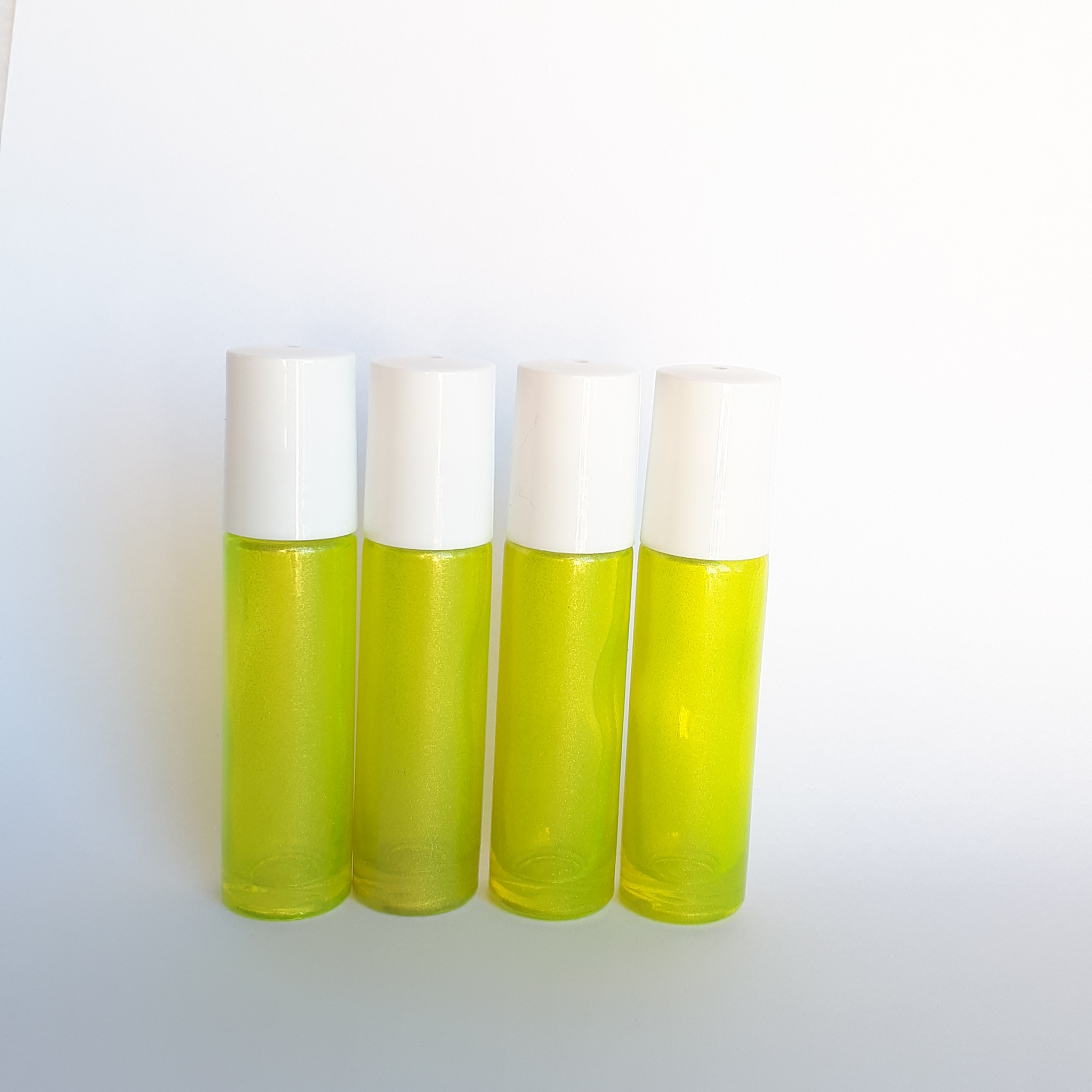 Download 10ml Yellow Roller Bottle With Plastic Roller 4pack Oil Jenneration PSD Mockup Templates