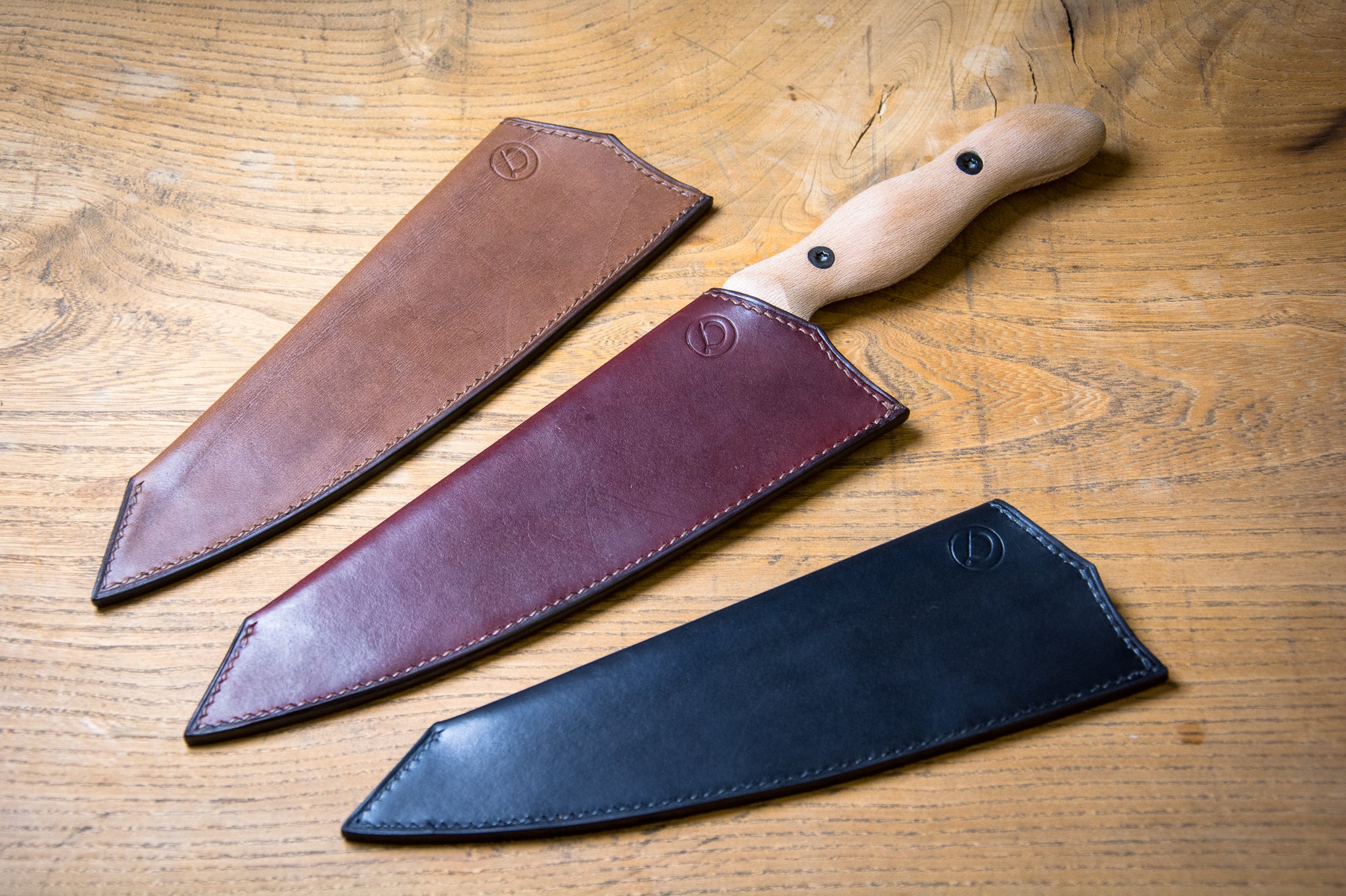 Saddle leather knife sheaths made by Delmotte Leathercraft