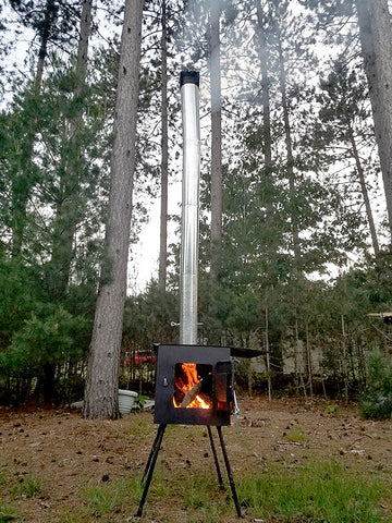 Wood burning stove in forest.