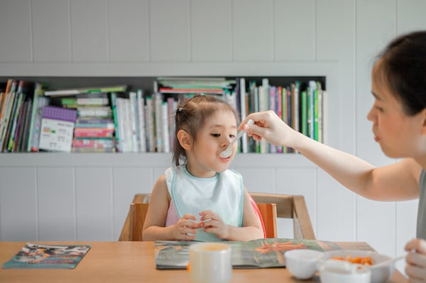 feeding toddler food happy