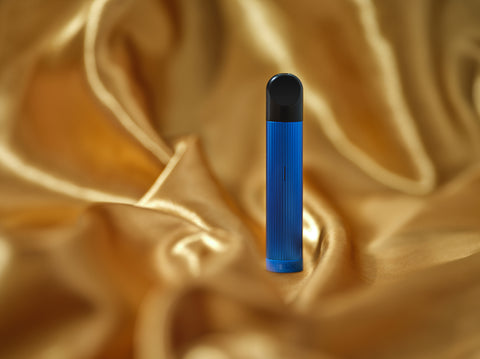 RELX Essential Blue dengan latar emas.