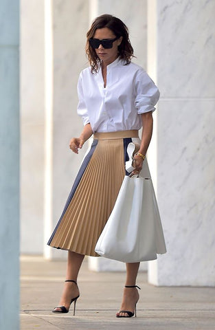 Victoria Beckham Pleated skirt neutrals with strap heels outfit