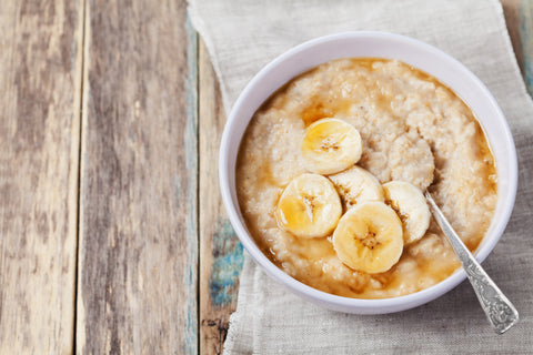 Porridge bowel with porridge, banana slices and honey