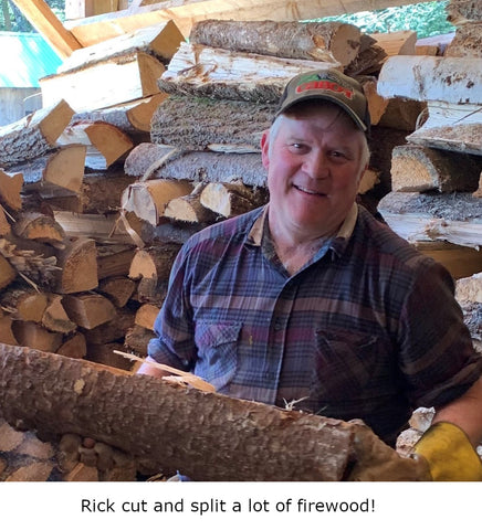 Maple Farmer Rick from Gilead Brook Farm in Bethel Vermont stacking wood in his Vermont maple syrup sugarhouse