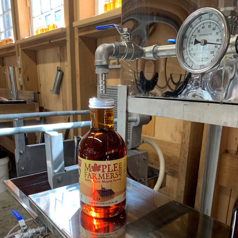 bottling pure Vermont maple syrup in the sugarhouse