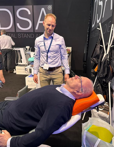 Happynecsk at IDS 2023 in Cologne. People experiencing our headrest for dental chairs