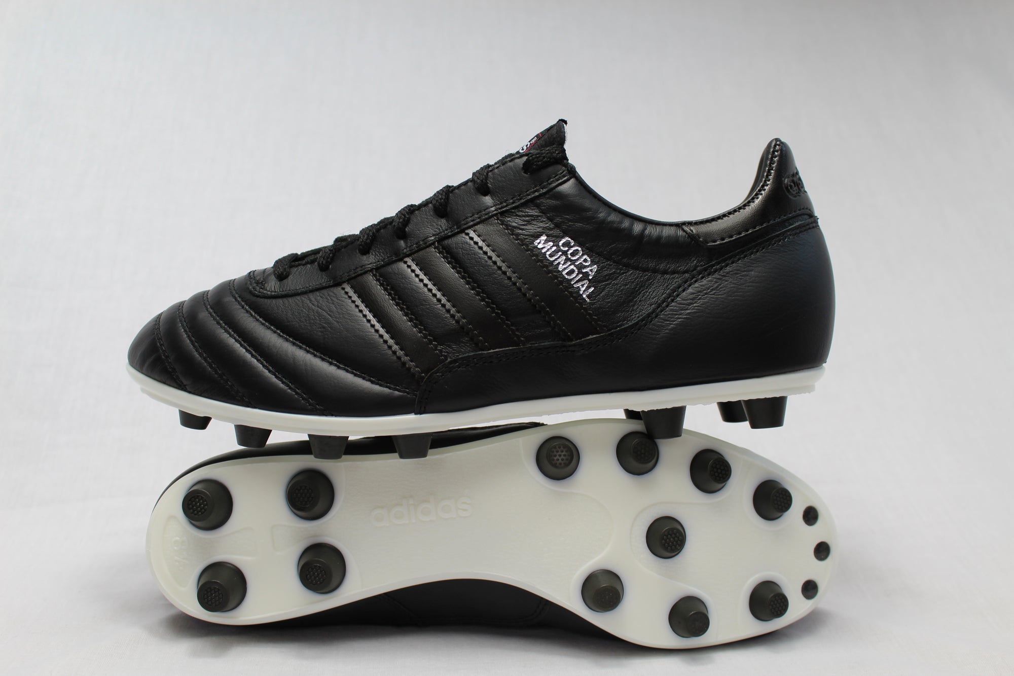 triple black football boots