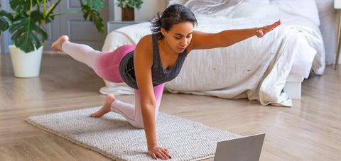 lady doing pilates exercise online