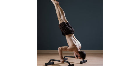 bottom of a handstand pushup position showing nice straight body line