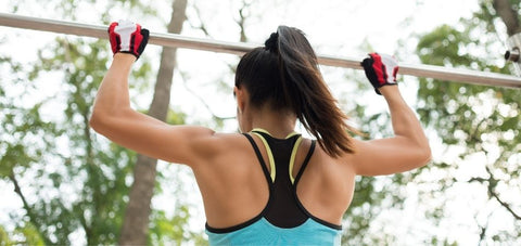 lady holding on a pull up bar