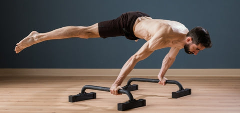 planche exercise done on a PBar