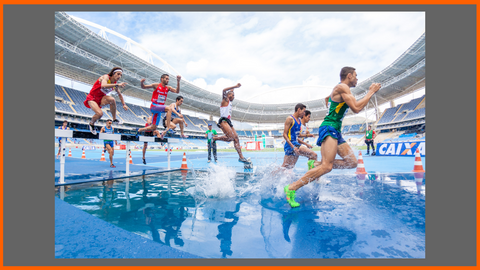 Many Athletic People Running and Jumping over Water, Hurdles and Obstacles in a Race