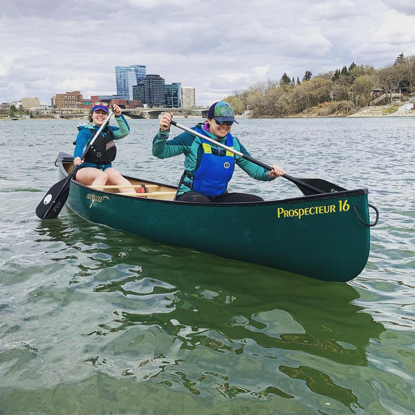 people paddling a canoe on the Saskatchewan River 