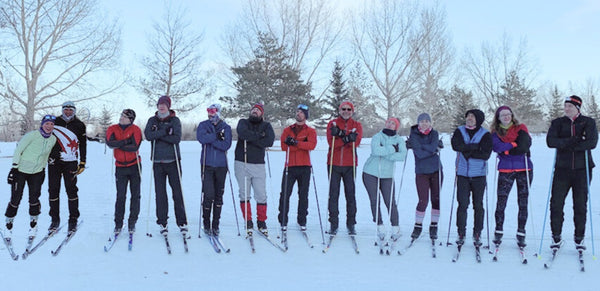 people in a cross country ski lesson