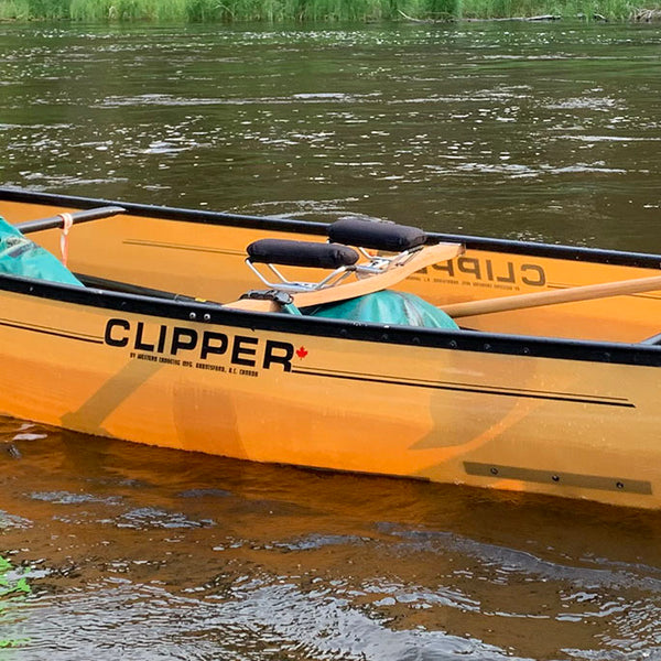 ultralight kevlar canoe floating on a lake 