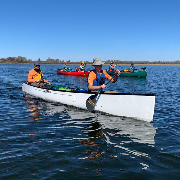 canoes paddling on a lake 