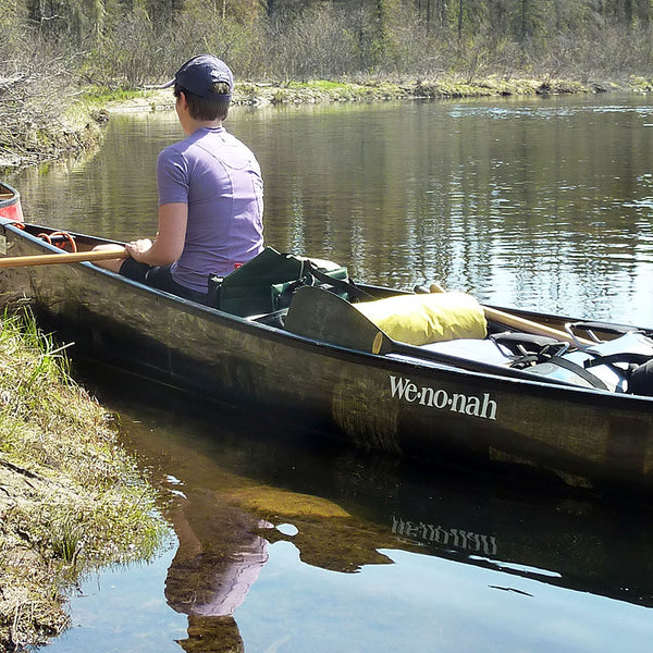 carbon graphite canoe on the water 