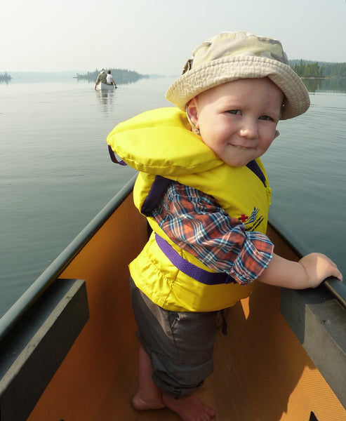 kid in the bow of canoe