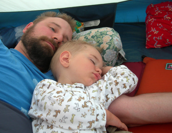 child sleeping in tent