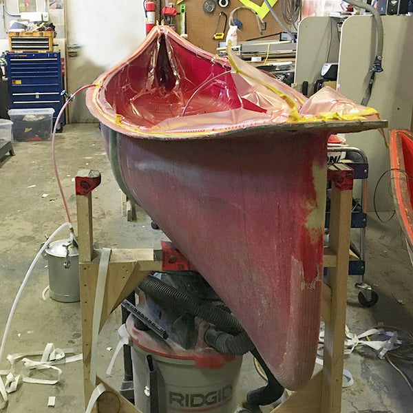 canoe mold being vacuum bagged 