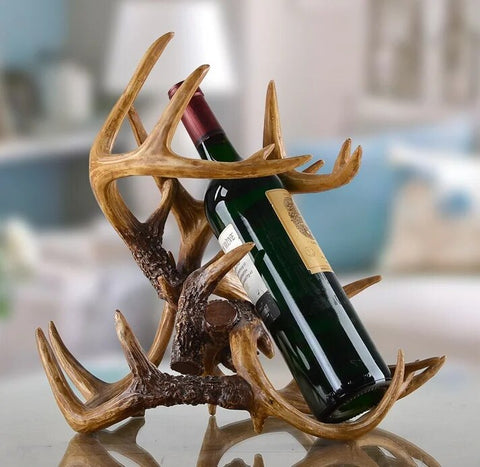 Antler Wine Bottle Holder by Allthingscurated is hand-crafted from resin and hand-painted to emulate the look of genuine antlers. Its beautiful sculptural form makes it a great gift for any occasion as well as a perfect addition for the holiday to give your winter tablescape a cabin vibe and for holding your favorite wines a the table. On its own, it’s a decorative, ornamental piece that gives a luxurious look to your mantel, tabletop or shelf. Measuring approximately 33cm or 13 inches in height, 35cm or 13.7 inches wide and a depth of 23cm or 9 inches. data-mce-fragment=