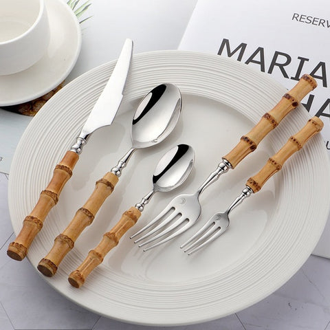 Allthingscurated Natural Bamboo Cutlery Set consisting of 1 dinner knife, 1 dinner spoon, 1 dinner fork, 1 teaspoon and 1 fruit fork. Available in 5-piece set for 1 person, or 20-piece set for 4 persons and 30-piece set for 6 persons. Made of 18/10 stainless steel and natural bamboo for handle.