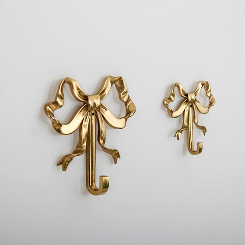 These pretty wall hooks by Allthingscurated are made of high-quality brass with a vintage gold finish.  Fashioned like a bow tied with ribbon, it’s feminine and perfect for the walk-in wardrobe or powder room. Comes in small and large size. Small hook measures 7.3cm or 2.8 inches in height and 6.5cm or 2.5 inches in width. Large hook measures 10.3cm or 4 inches in height and 9.5cm or 3.7 inches in width. Sold as individual hooks or a set of small and large hooks.