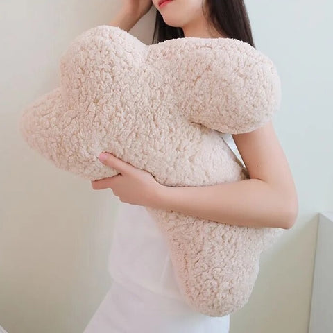 Cozy Teddy Bunny Pillow by Allthingscurated shaped like a cute bunny is sewn from soft, fluffy teddy fabric.  The hug pillow is cute, cuddly and oh-so-cozy. Its playful shape will bring a quirky charm to any room. Available in white, sand, red and blue.