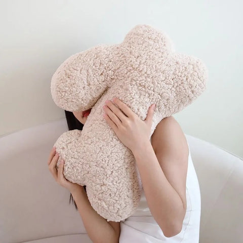 Cozy Teddy Bunny Pillow by Allthingscurated shaped like a cute bunny is sewn from soft, fluffy teddy fabric.  The hug pillow is cute, cuddly and oh-so-cozy. Its playful shape will bring a quirky charm to any room. Available in white, sand, red and blue.